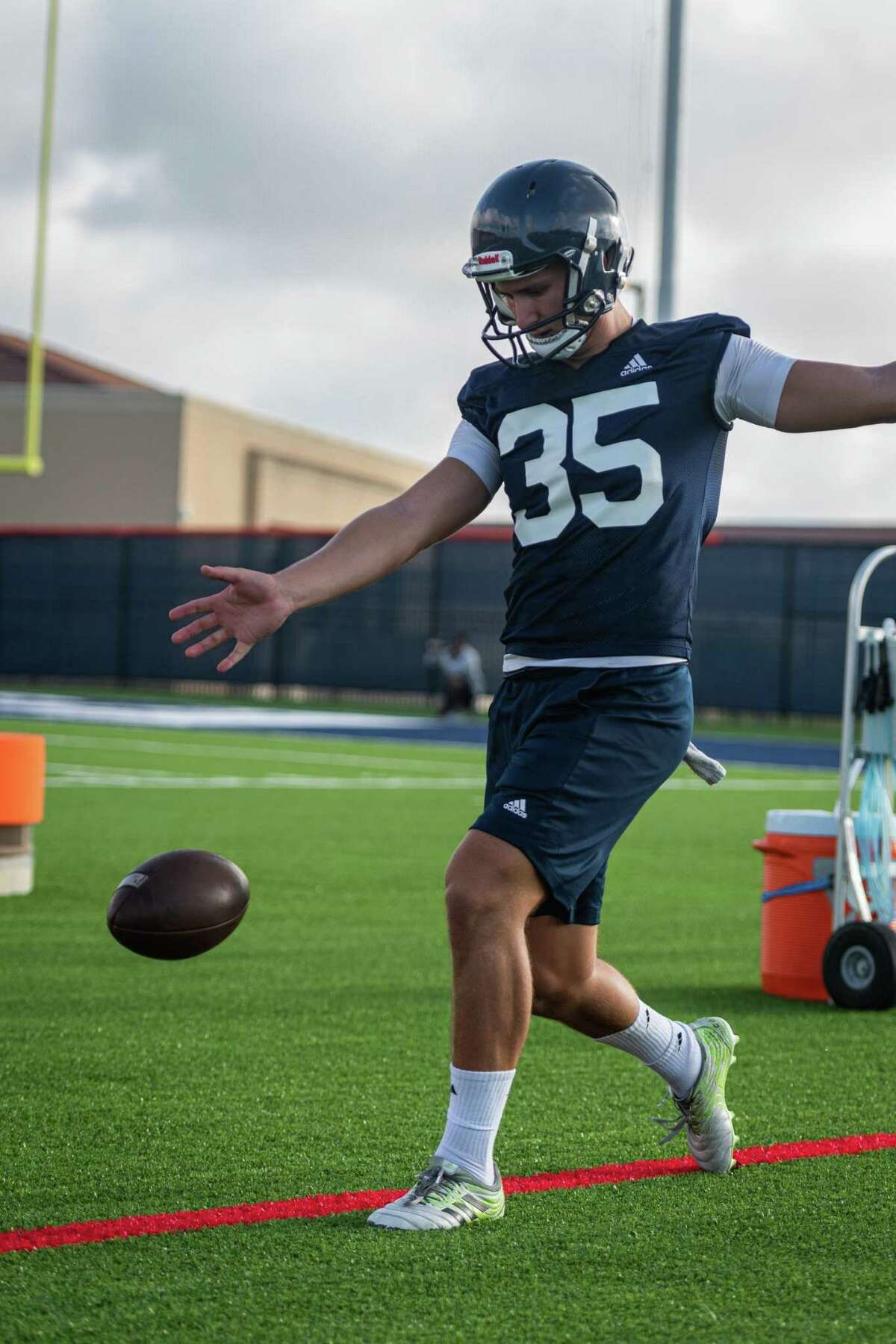 On Saturday morning of August 7th, 2021, UTSA's football team holds practice on the field by the new Roadrunner Athletic Center of Excellence (RACE) in San Antonio, Texas. Here, Punter Lucas Dean practices kicks.