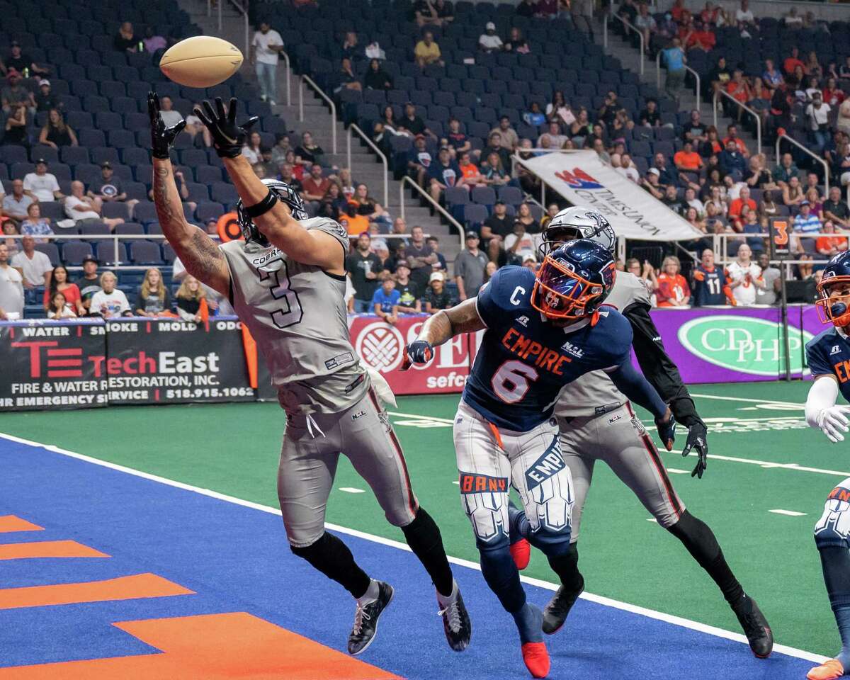 Carolina Cobras defender Tevin Homer nearly has an interception in front of Albany Empire receiver Darius Prince during the Empire's season-opening loss in April. The Cobras completed the sweep of the Empire on Saturday night.