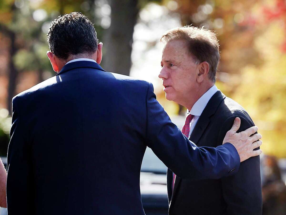 Governor Dannel P. Malloy, left, talks with Connecticut's new governor-elect Ned Lamont at the Governor's residence for lunch in Hartford, Conn., Thursday, Nov. 8, 2018.