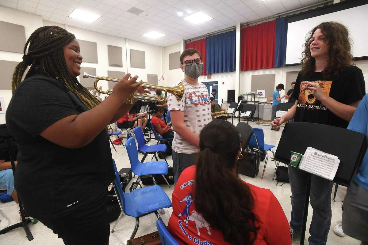 West Brook's Soundpower marching band rjoke on a reak as they rehearse in the band hall and prepare for the 2021 season start. Photo made Monday, August 2, 2021 Kim Brent/The Enterprise