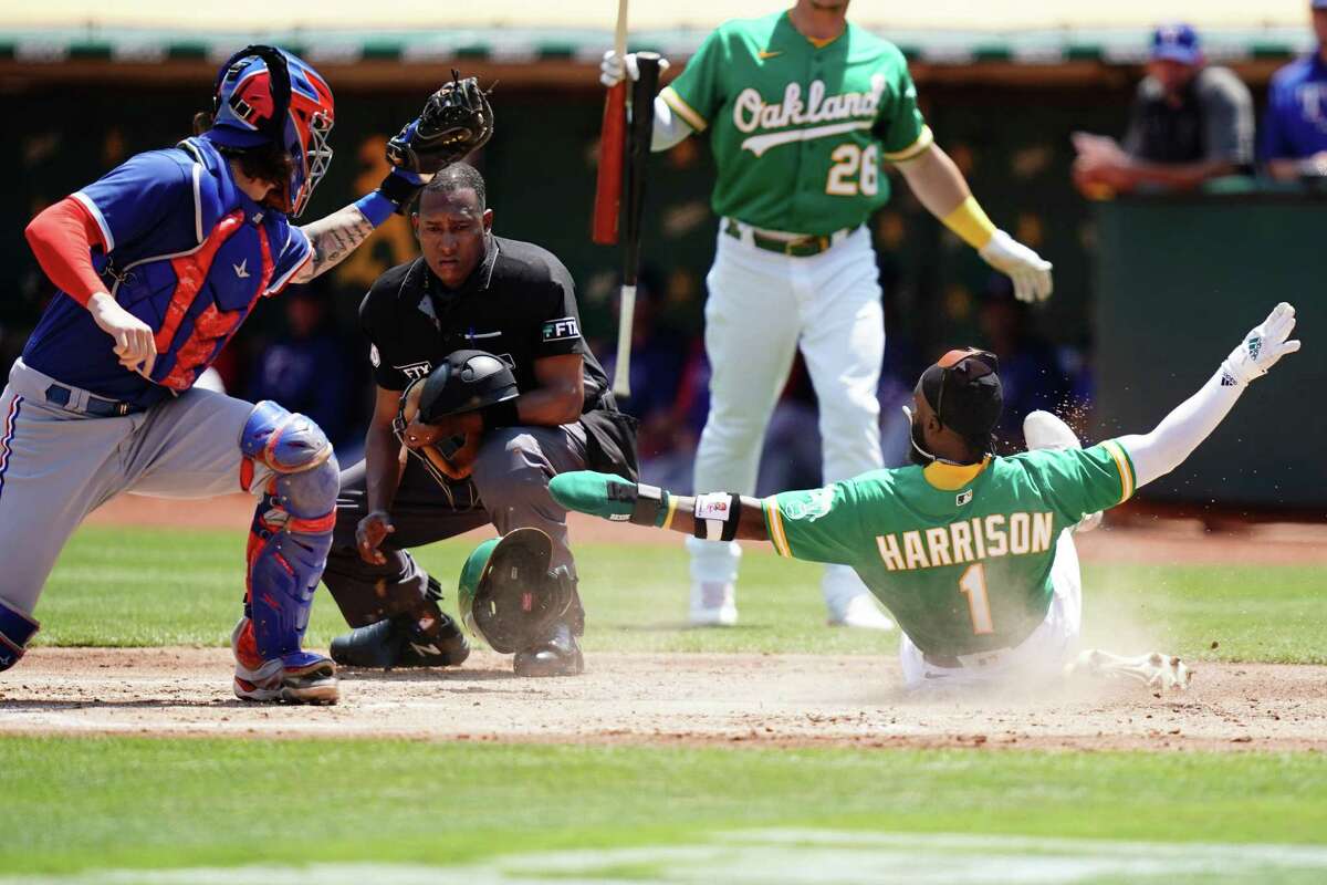 OAKLAND, CA - MAY 29: Texas Rangers catcher Jonah Heim (28) looks