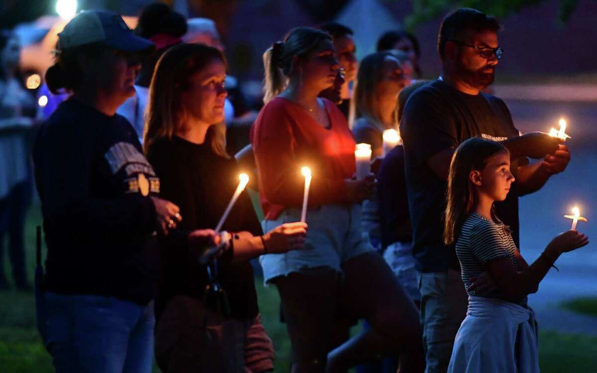 Supporters attend candlelight vigil for 14 year old Gianna Vincelett Saturday August 8, 2021, on the town green in Higganum, Conn. Vincelett was recently killed by a hit and run driver while riding her bicycle.