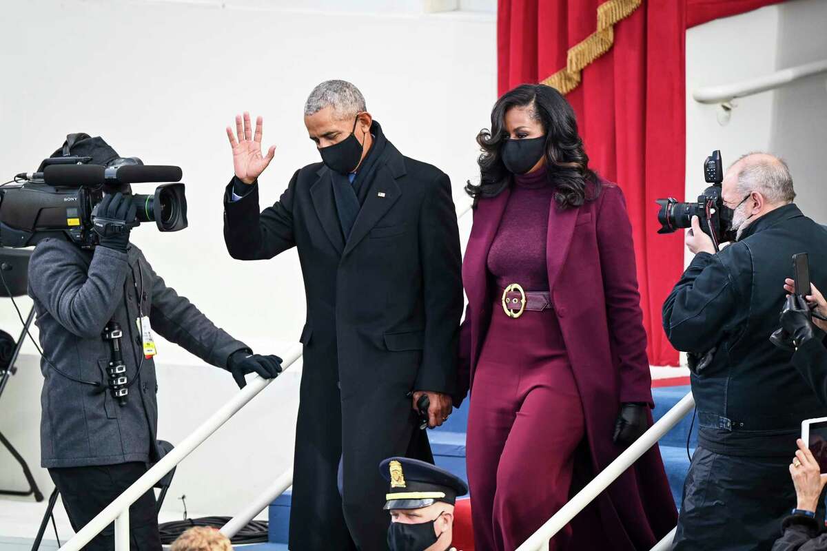 Barack and Michelle Obama arrive before Joe Biden is sworn in as 46th President of the United States on January 20, 2021 in Washington.