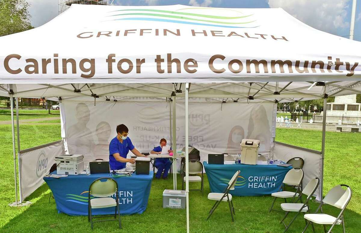 New Haven, Connecticut - Thursday, August 6, 2021: Griffin Health employees at a vaccination center Thursday on the New Haven Green.