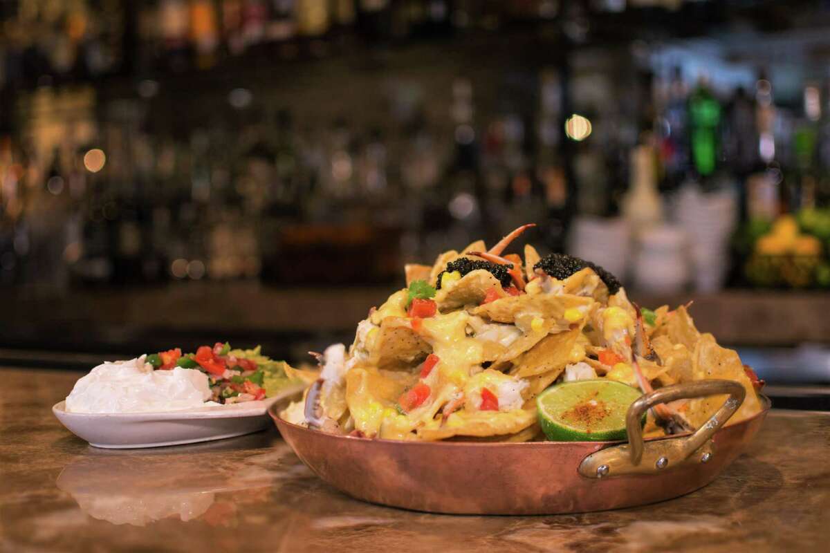 Blue crab and caviar nachos is a secret menu item at Brennan's of Houston, available at the bar and courtyard.