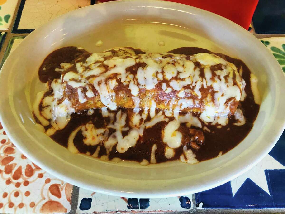 The Raymondville (a burrito filled with chicken or beef fajitas and topped with chili gravy) is a secret menu item at Sylvia's Enchilada Kitchen.
