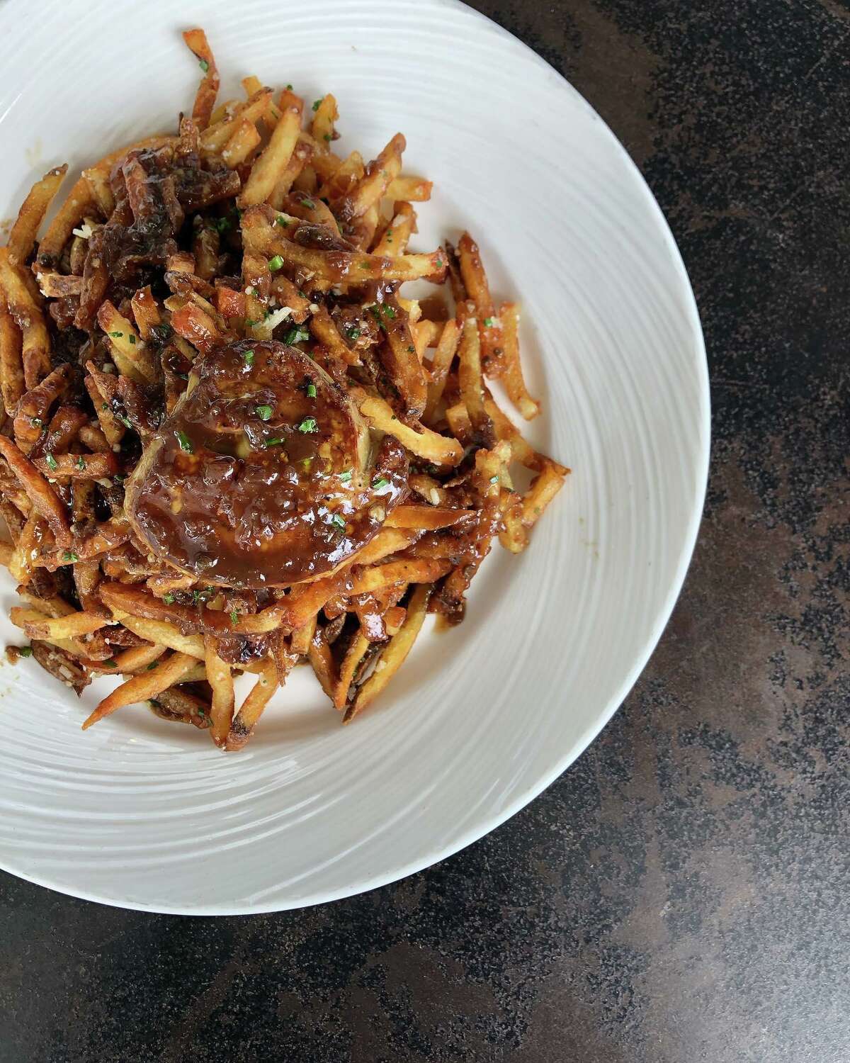 Lazy Lane Fries made with foie gras and truffle oil are a secret menu item at Brasserie 19