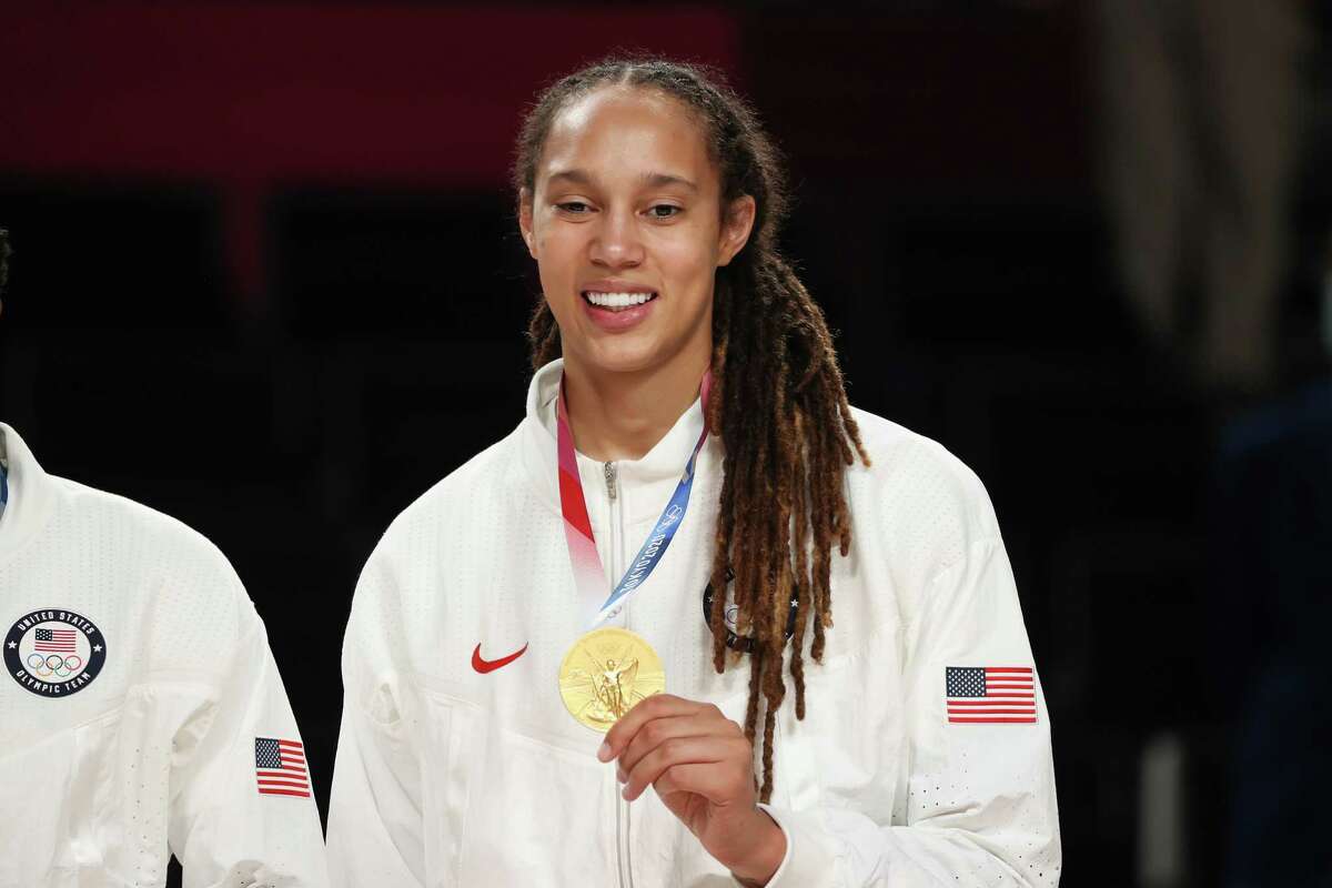 SAITAMA, JAPAN - AUGUST 08: Brittney Griner #15 of Team United States poses for photographs with her gold medal during the Women's Basketball medal ceremony on day sixteen of the 2020 Tokyo Olympic games at Saitama Super Arena on August 08, 2021 in Saitama, Japan.