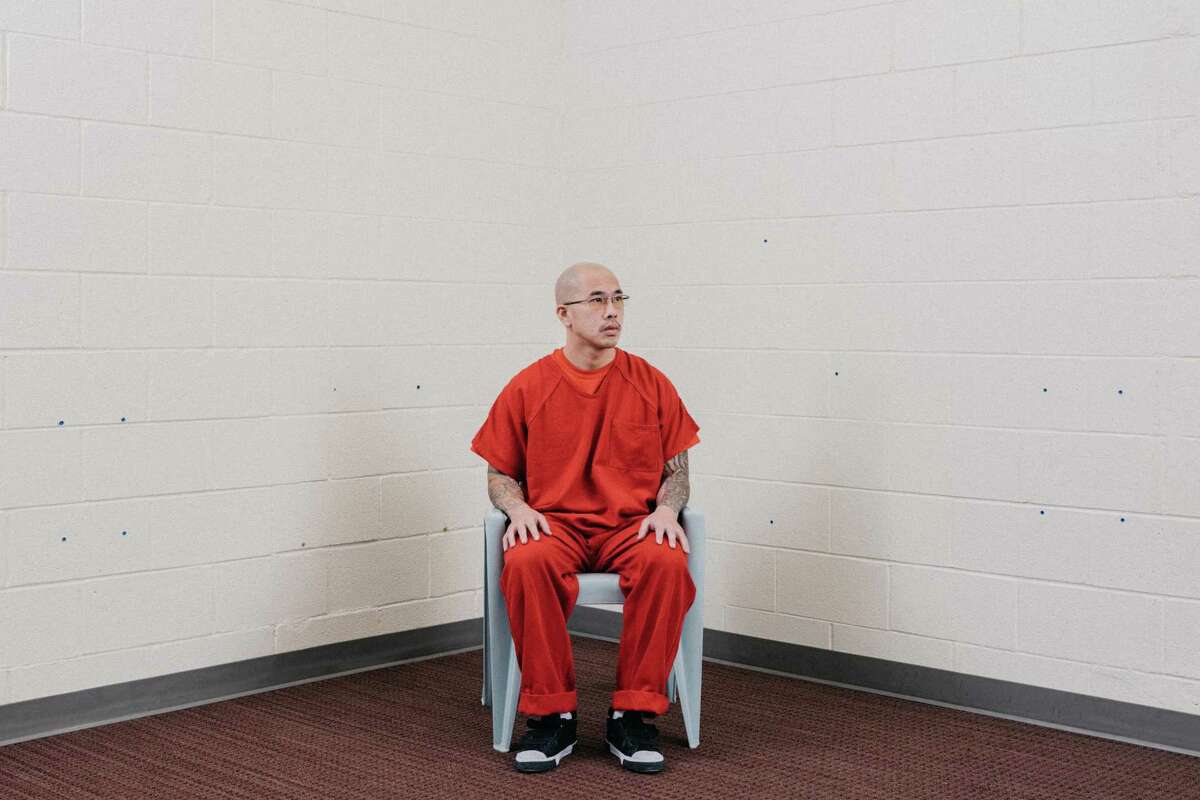 Phi Pham, who grew up in the East Bay, poses for a portrait in an ICE detention facility in Aurora, Colorado, on Aug. 2.