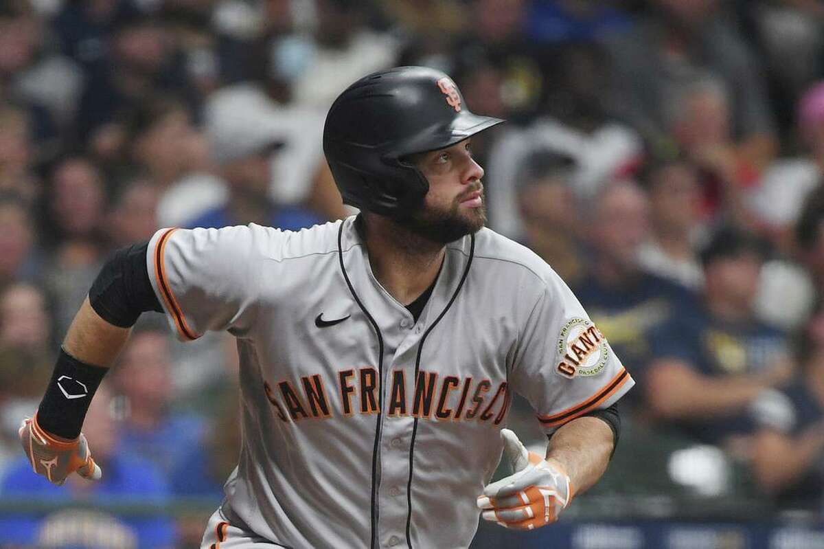 MILWAUKEE, WISCONSIN - AUGUST 07: Brandon Belt #9 of the San Francisco Giants hits a home run in the fourth inning against the Milwaukee Brewers at American Family Field on August 07, 2021 in Milwaukee, Wisconsin. (Photo by Quinn Harris/Getty Images)