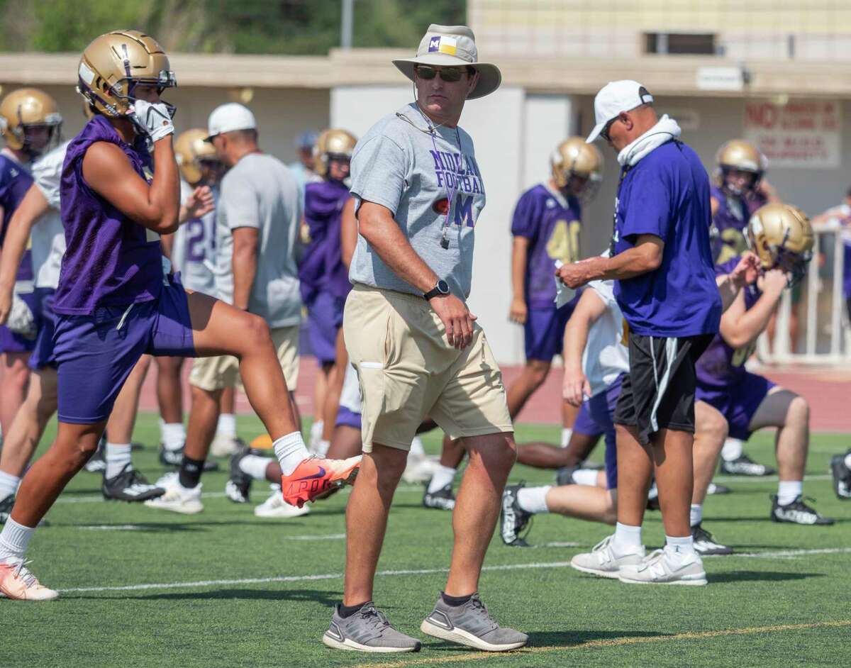 Coach Thad Fortune watches as his Midland High players run drills 08/09/2021 during the afternoon practice at Memorial Stadium. Tim Fischer/Reporter-Telegram