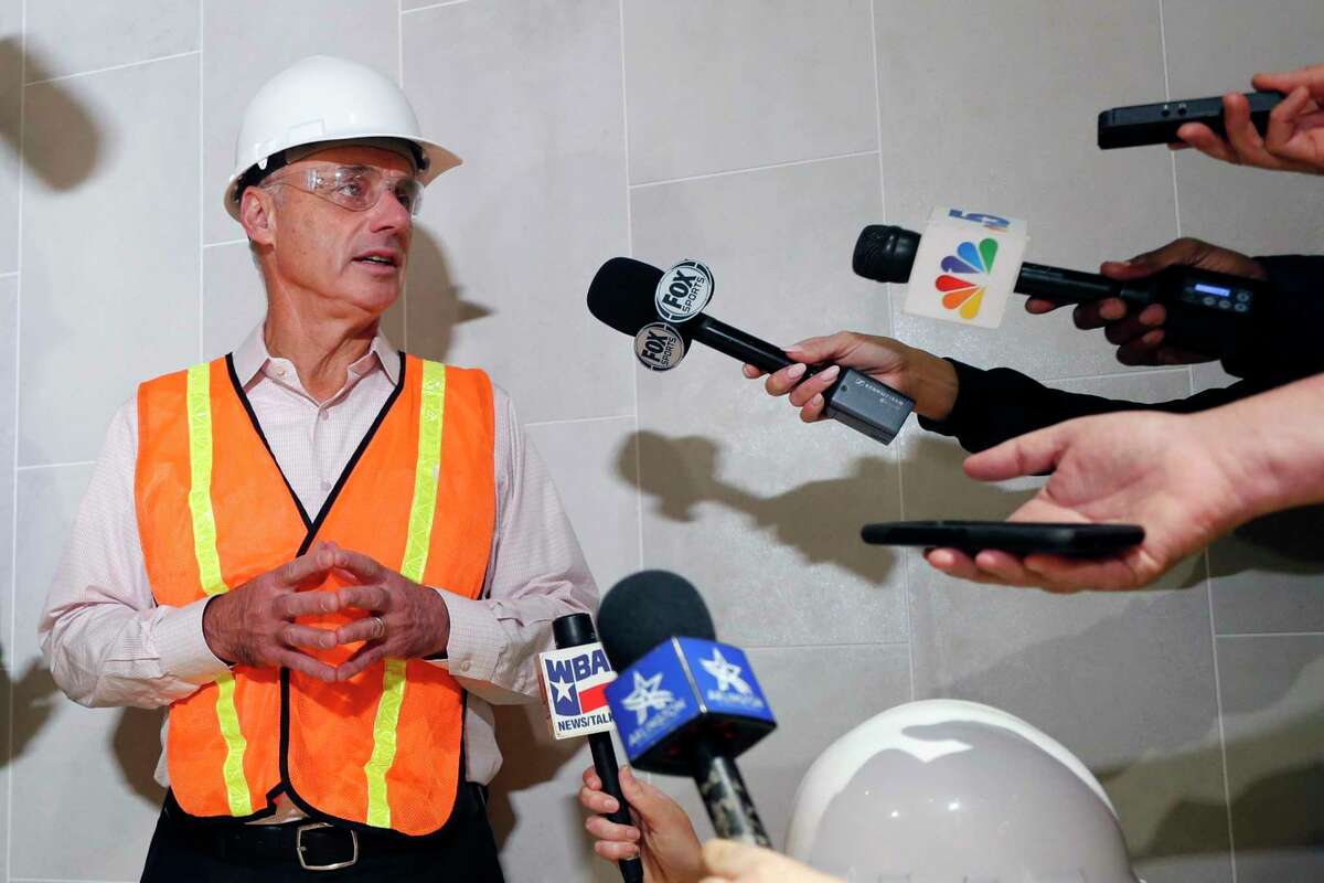 Baseball Commissioner Rob Manfred speaks to the media during a tour of the under construction new Texas Rangers stadium in Arlington, Texas, Tuesday, Nov. 19, 2019. Manfred hopes the investigation into sign stealing by the Houston Astros will be completed by next season and says he has broad authority to impose discipline beyond fines, the loss of amateur draft picks and taking away international signing bonus pool allocation. (AP Photo/LM Otero)