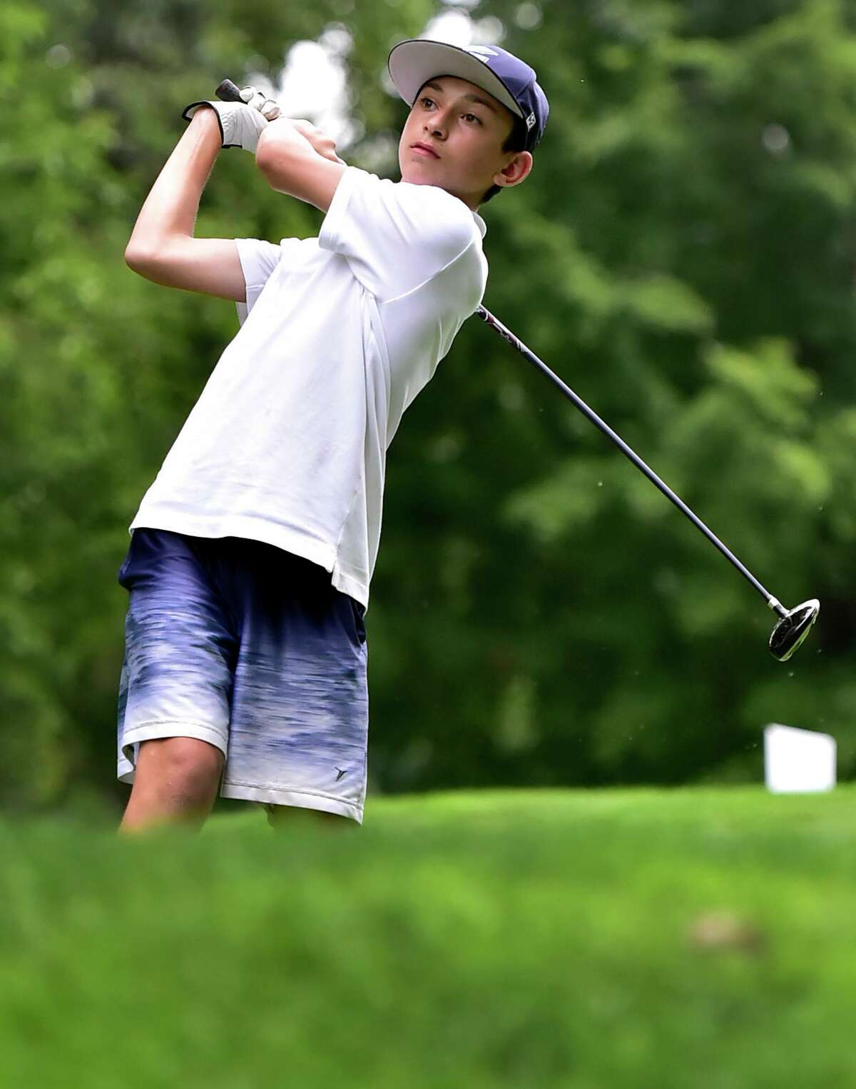 John Paul Malafronte, 13, uses a driver at the 9th hole during the first Chip Malafronte Memorial Golf Tournament For The Boy at Race Brook Country Club in Orange on Monday.