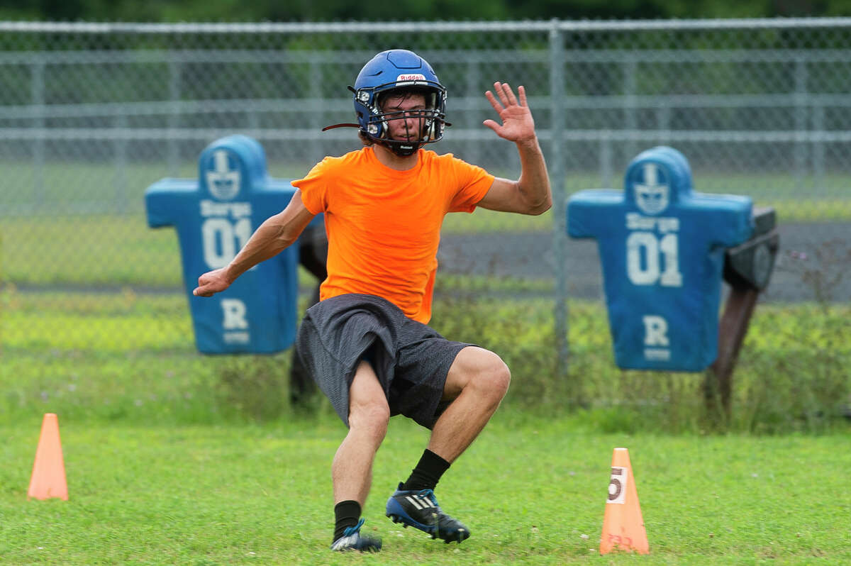Coleman's Jack Wiggins completes a conditioning drill during the Comets' first football practice of the season Monday, Aug. 9, 2021 at Coleman High School. (Katy Kildee/kkildee@mdn.net)