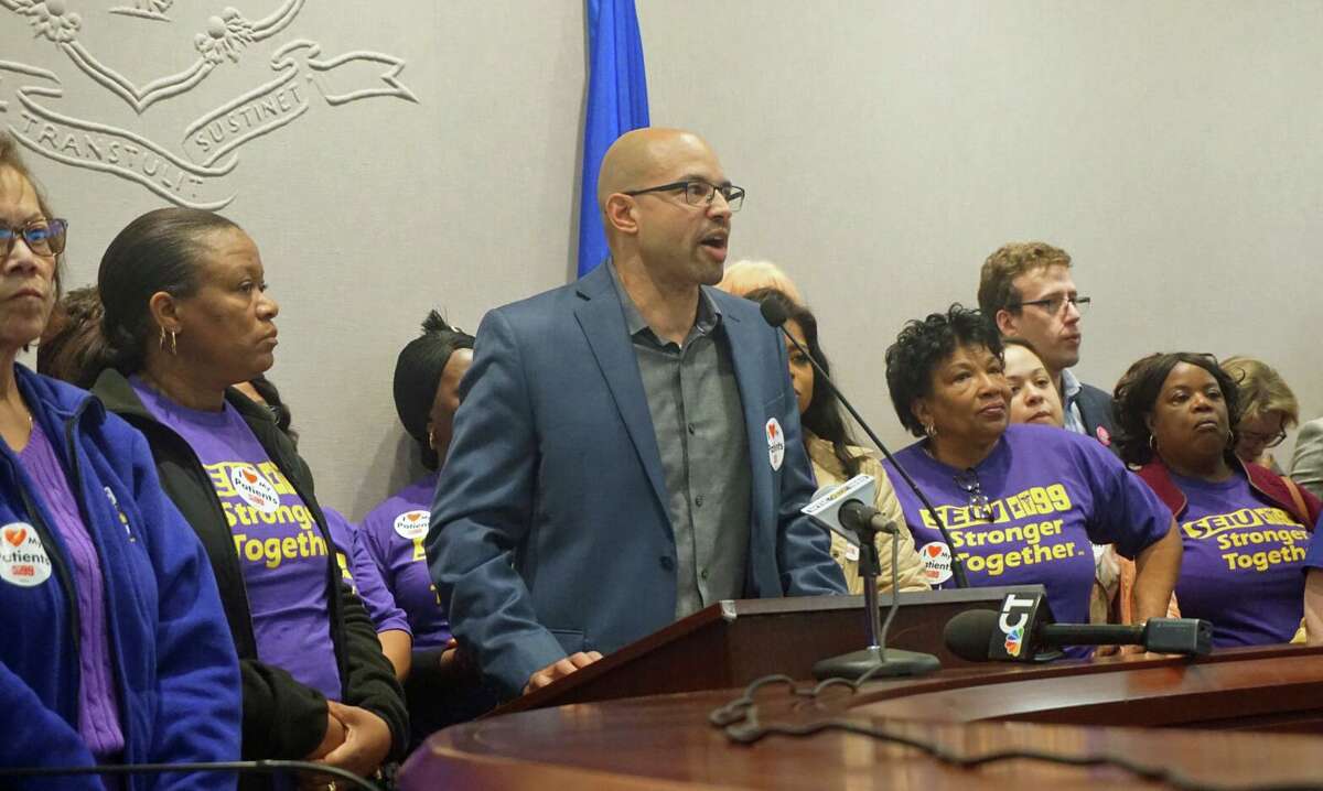 Rob Baril, president of SEIU 1199 New England, with nursing home workers who came to the state Capitol in Hartford, Conn. on Wednesday May 1, 2019.