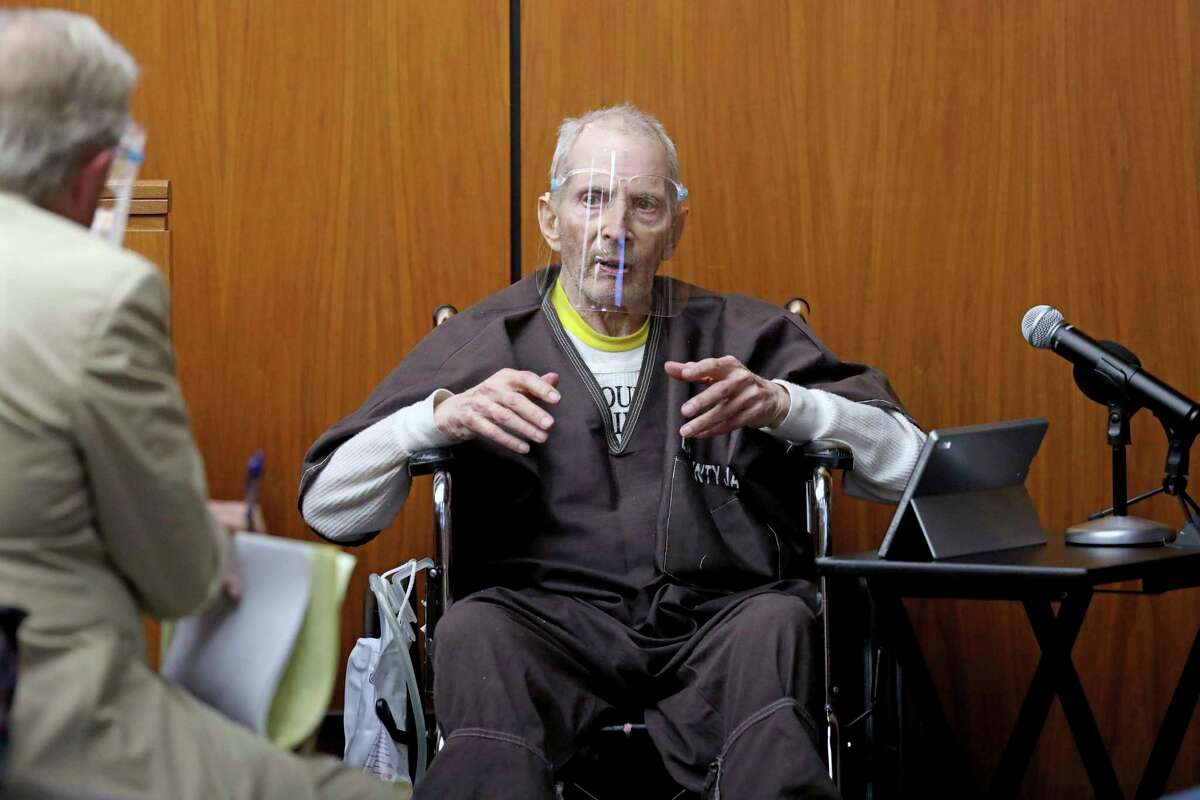 New York real estate scion Robert Durst, 78, answers questions from defense attorney Dick DeGuerin, left, while testifying in his murder trial at the Inglewood Courthouse on Monday, Aug. 9, 2021, in Inglewood, Calif. Durst is charged with the 2000 murder of Susan Berman inside her Benedict Canyon home. He testified Monday that he did not kill his best friend Berman. (Gary Coronado / Los Angeles Times via AP, Pool)
