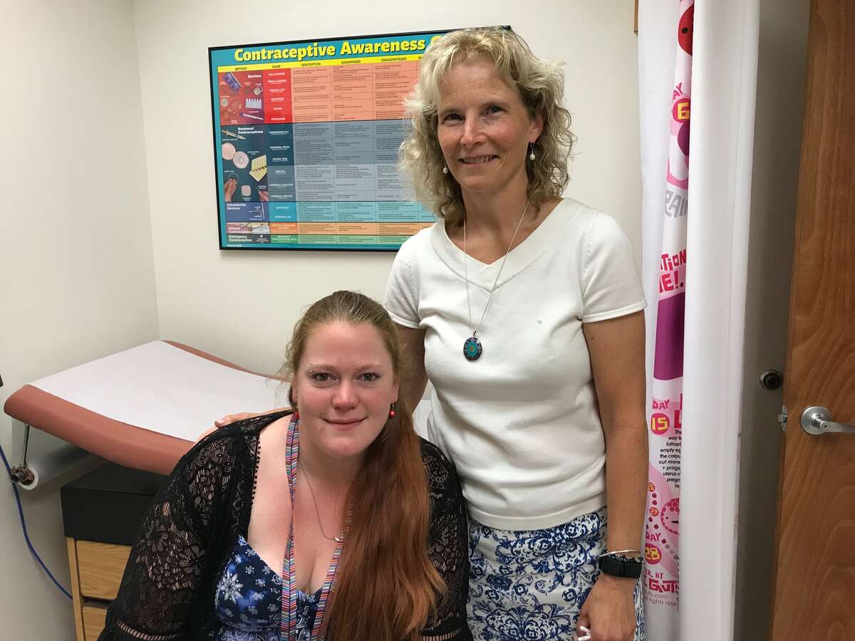 Cortney Hess, left, has remained clean in long-term recovery for heroin addiction with the help of Suboxone and nurse practitioner Laura Churchill, right, at her clinic in Catskill.