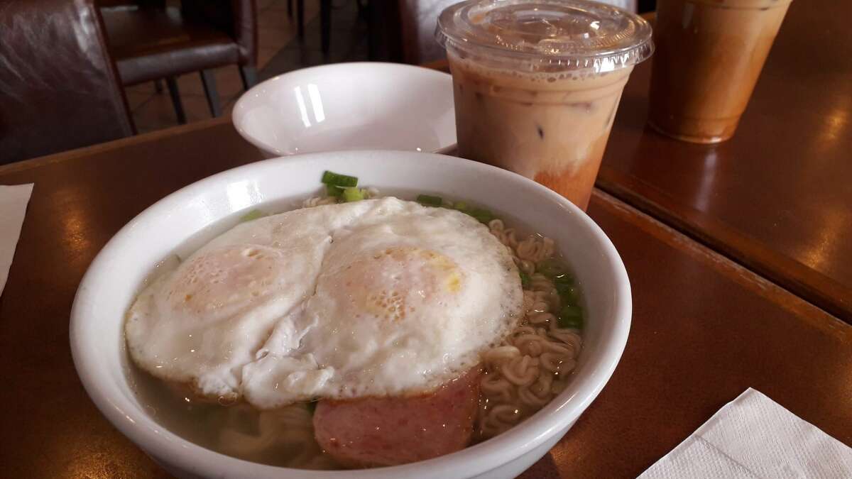 Instant noodles with spam and fried eggs are a cha-chaan-teng breakfast staple.