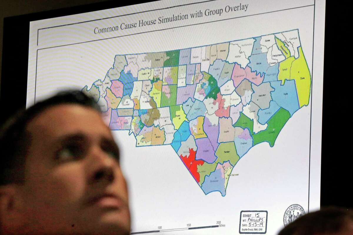 FILE - In this Monday, July 15, 2019 file photo, a state districts map is shown as a three-judge panel of the Wake County Superior Court presides over the trial of Common Cause, et al. v. Lewis, et al, in Raleigh, N.C. Fresh off sweeping electoral victories a decade ago, governors and lawmakers in several states used new census data to redraw voting districts for Congress and state legislatures that were intended to help their party remain in power for years to come. Those efforts largely paid off, particularly for Republicans. An Associated Press analysis designed to detect the effects of gerrymandering shows that Republicans enjoyed a greater political advantage in more states over the past decade than either party had over the past 50 years.