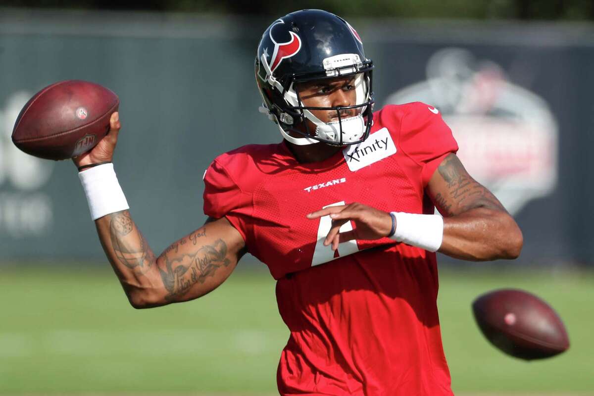 Houston Texans quarterback Deshaun Watson drops back to pass during an NFL training camp football practice Tuesday, Aug. 10, 2021, in Houston.