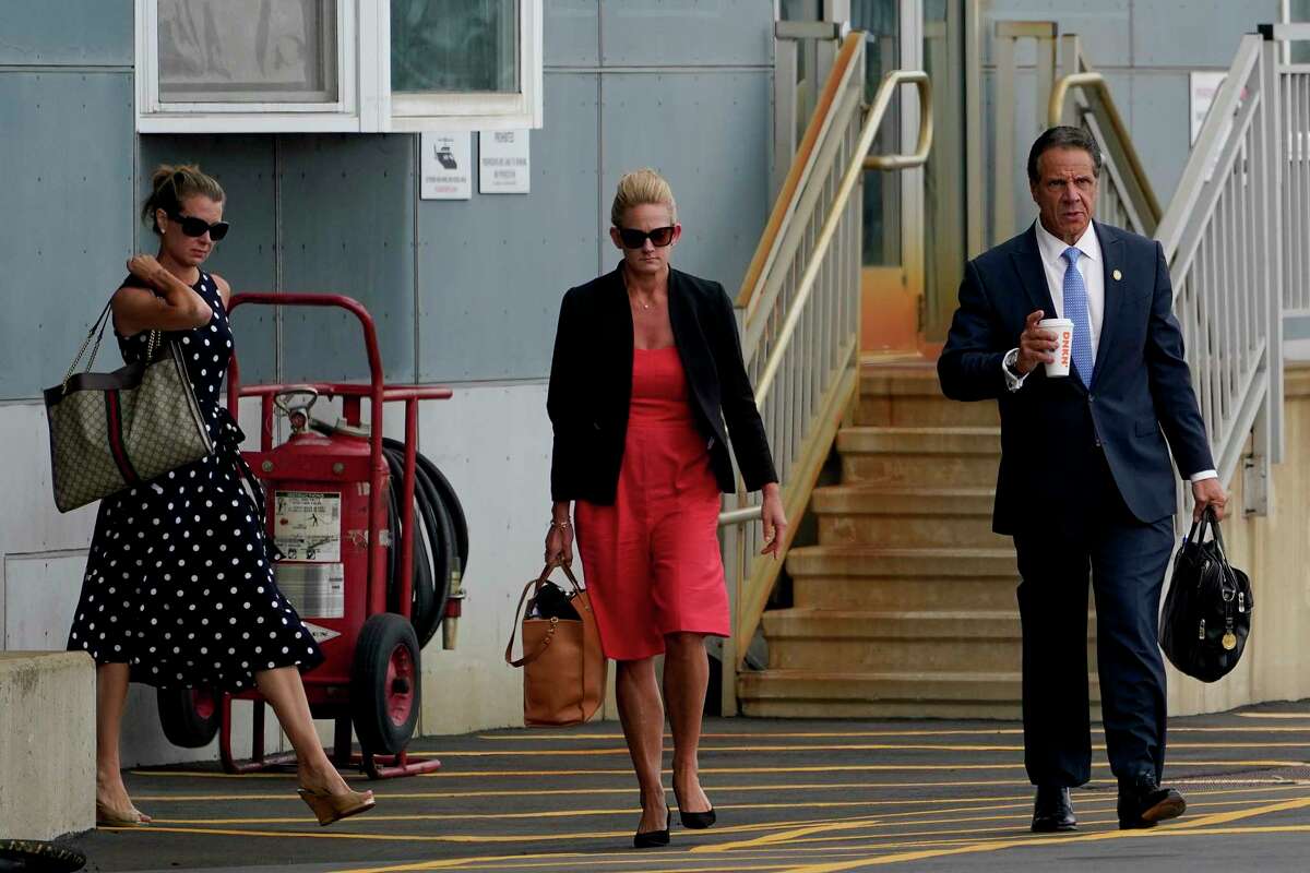 New York Gov. Andrew Cuomo prepares to board a helicopter after announcing his resignation, Tuesday, Aug. 10, 2021, in New York. Cuomo says he will resign over a barrage of sexual harassment allegations. The three-term Democratic governor's decision, which will take effect in two weeks, was announced Tuesday as momentum built in the Legislature to remove him by impeachment.