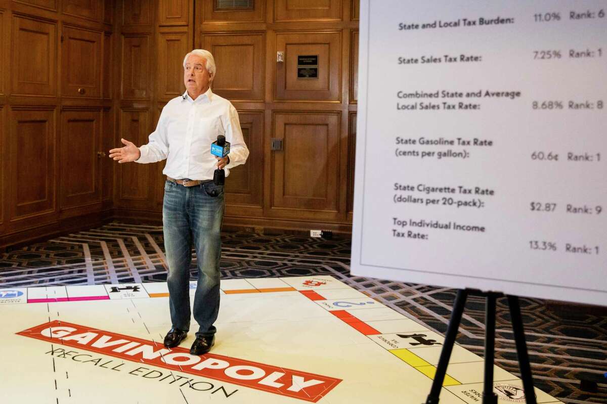 Republican candidate in the recall election for California governor John Cox stands on a makeshift Monopoly board to represent high costs in the state during a press conference held at Westin St. Francis in San Francisco.