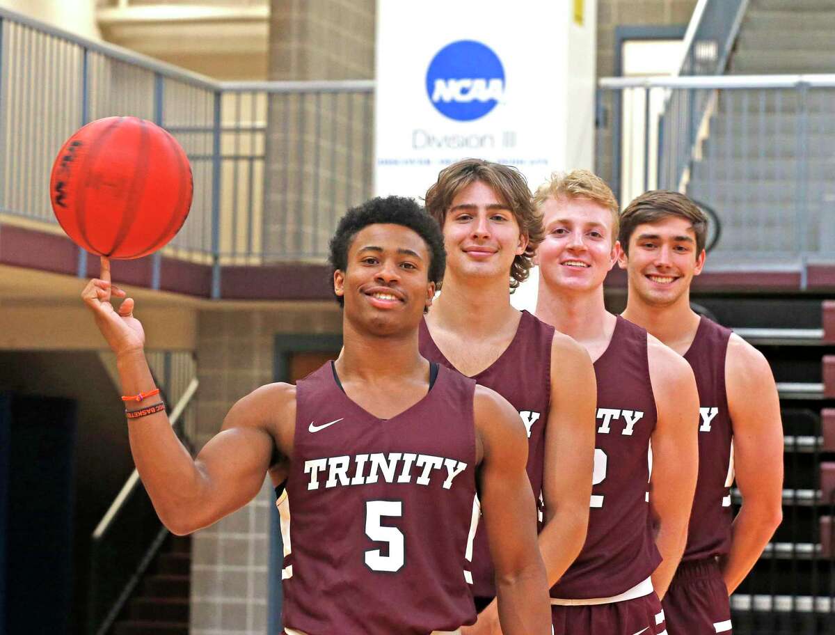 Kaleb Jenkins, from left, Tanner Brown, AJ Cark and Ben Hanley are a group of Trinity basketball players who helped the USA women’s 3-on-3 team prepare ahead of the squad’s gold-medal performance.