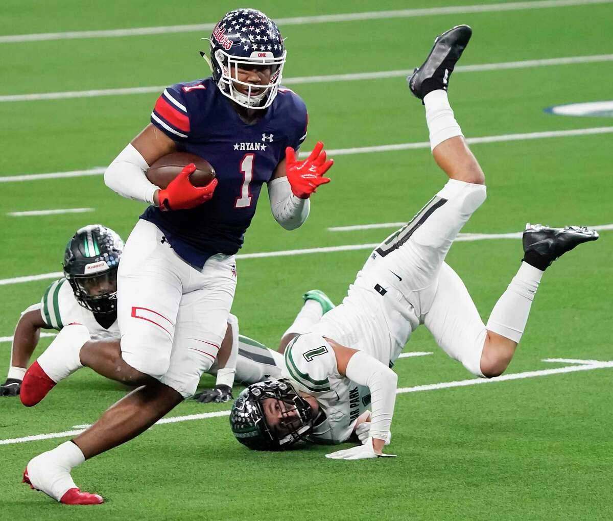 Denton Ryan wide receiver Ja'Tavion Sanders (1) gets past Cedar Park defensive back Cody Marshall during the first half of the Class 5A Division I Texas state football championship game at AT&T Stadium on Friday, Jan. 15, 2021, in Arlington, Texas. (Smiley N. Pool/The Dallas Morning News)