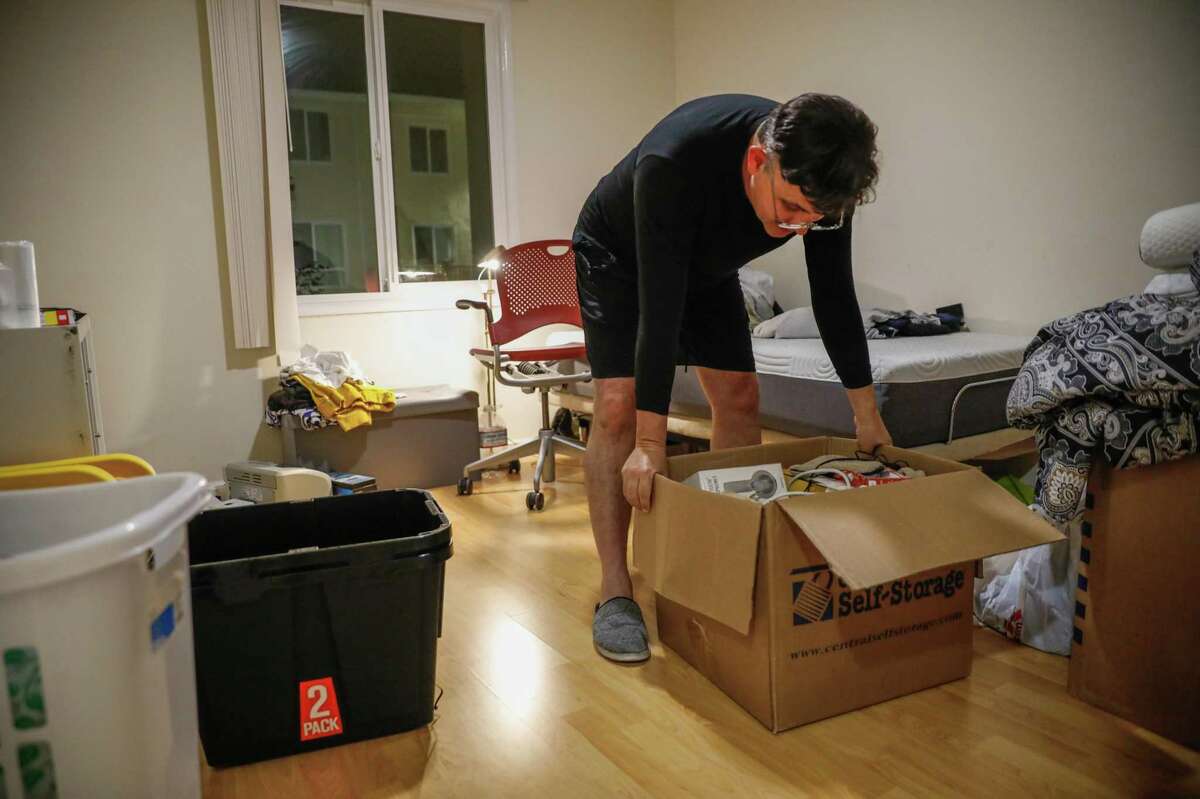 Marcelo Moraes packs up his apartment following a court-ordered eviction on Saturday, July 31, 2021 in Daly City, Calif. Moraes owes $47,000 in back rent after losing work due to the pandemic as well as being sick in February 2020.