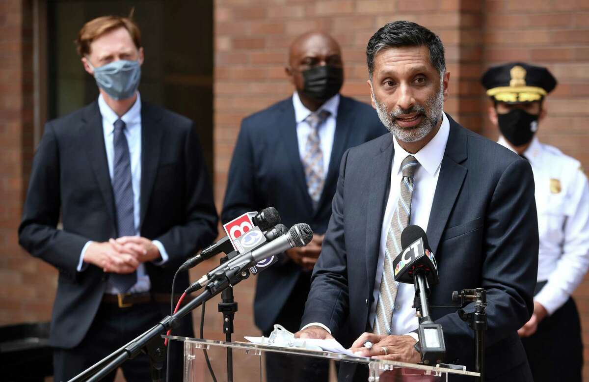 New Haven Community Services Administrator Dr. Mehul Dalal, right, speaks at a press conference announcing a proposed new city department, the Department of Community Resilience, outside of City Hall in New Haven on August 2, 2021.