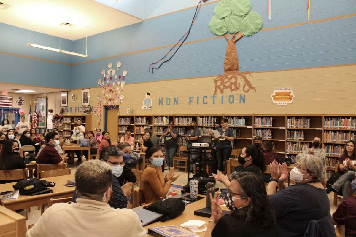 Teachers gather in the library at Lamar Bruni Vergara Middle School.