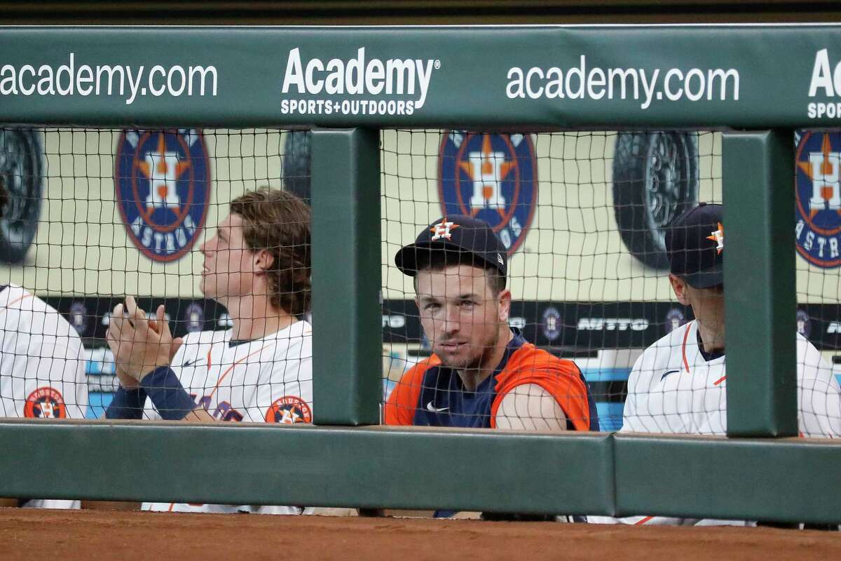 Houston Astros Alex Bregman cheers for Michael Brantley in the dugout after his single during the first inning at Minute Maid Park, Wednesday, August 11, 2021, in Houston.