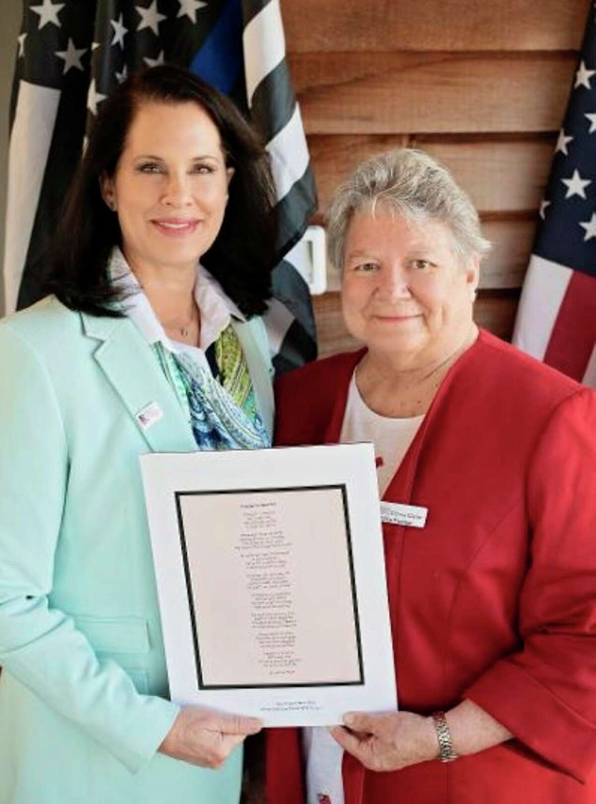 Jane Freeland-Gerschick (left) is awarded the Republican Women of Benzie County Woman of the Year Award by Donna Clarke (right), president of the club. (Courtesy Photo/Sondra Eddinger Halliday)