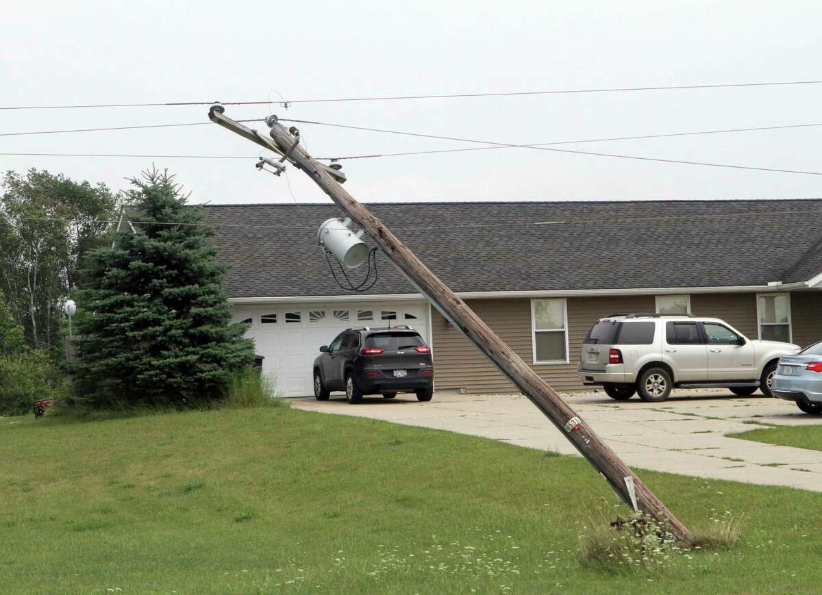 An electric pole five miles outside of Remus remains bent backward after Tuesday night's storm. (Pioneer photo/Joe Judd)