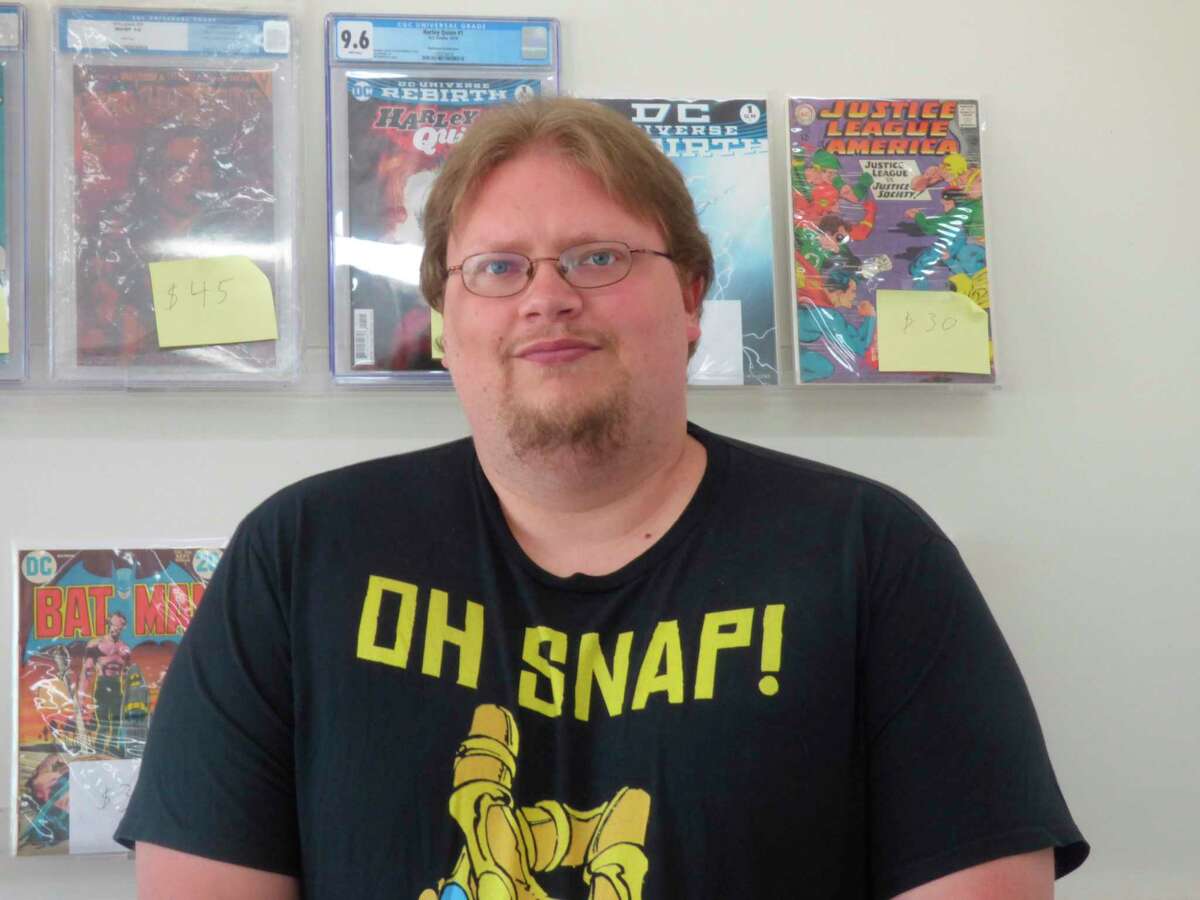 Greg Hiltz, owner of Rebel's Sanctuary, will be handing out free comic books from his store in Manistee on Saturday. (File Photo)