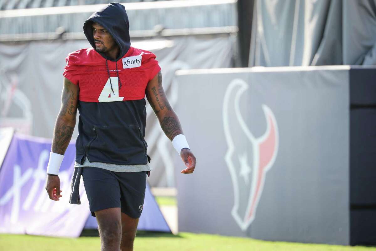 Houston Texans quarterback Deshaun Watson walks to the field during an NFL training camp football practice Thursday, Aug. 12, 2021, in Houston. Watson commented as he passed the group of media members shooting photos of him as he walked past, "“Why are you all always filming me every day? It’s the same (...).”