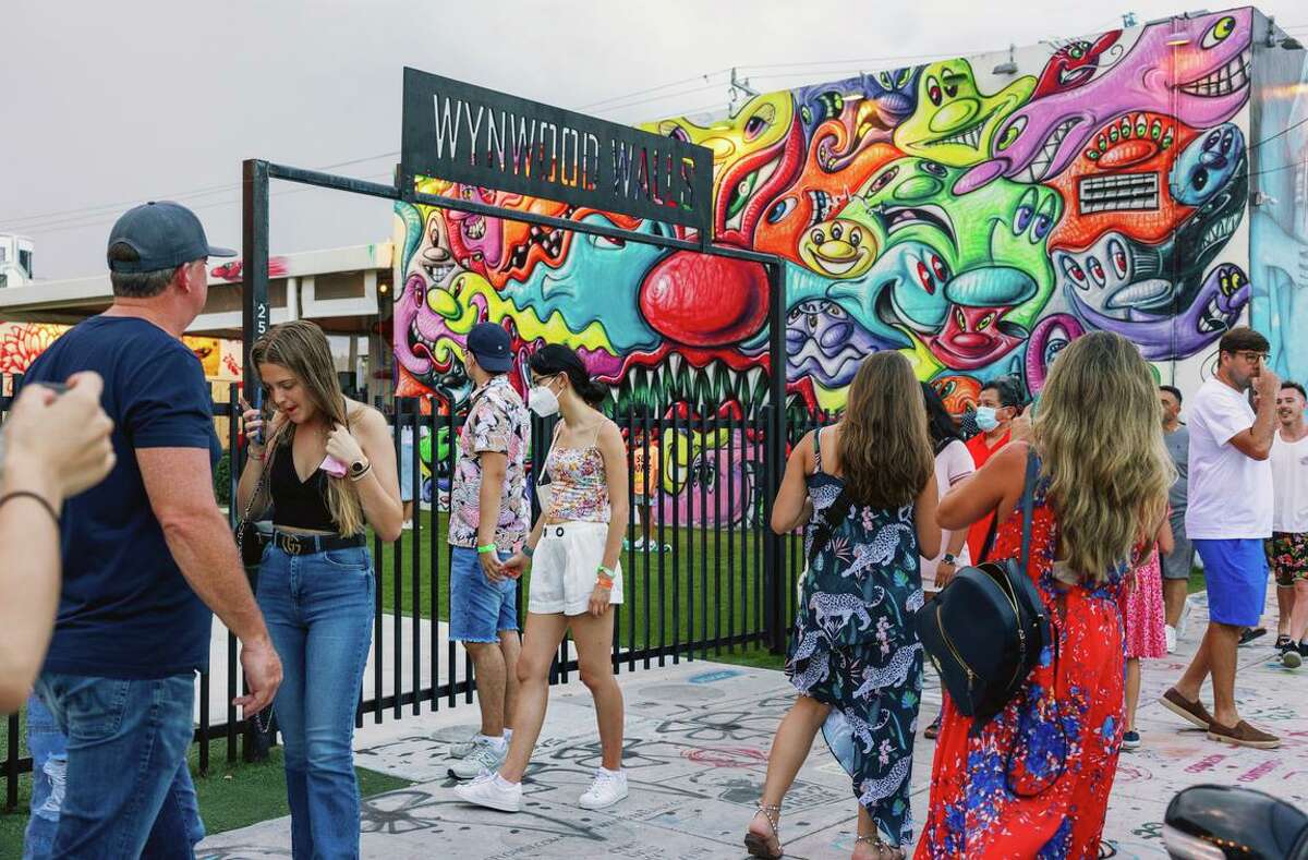 Wynwood, a Miami arts district once filled with neglected warehouses, is now home to startup incubators and upscale restaurants as tech firms move in.