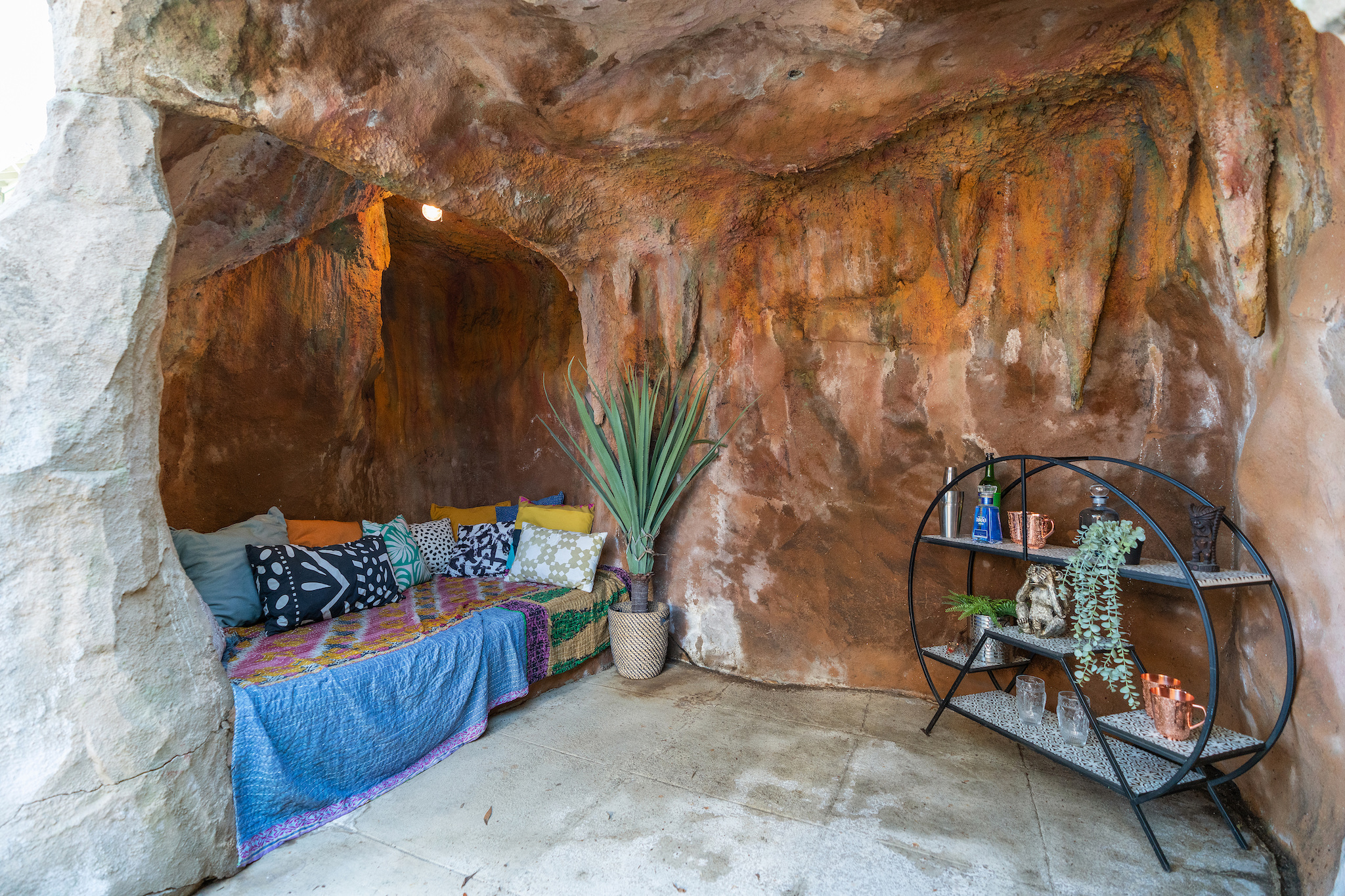 A cave like oasis outside is a charming place for relaxing.