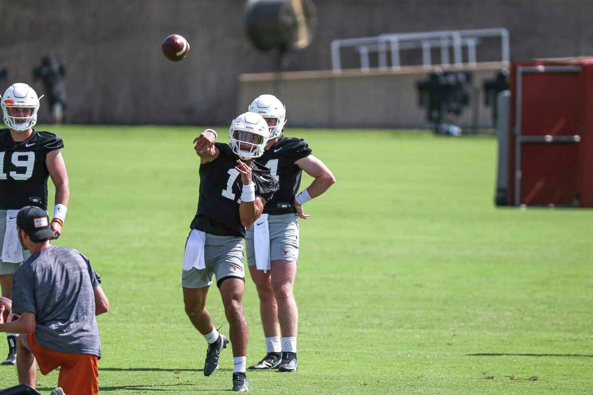 Texas quarterback Casey Thompson throws a pass during an NCAA college football practice Saturday, Aug. 7, 2021, in Austin, Texas. (Aaron E. Martinez /Austin American-Statesman via AP)