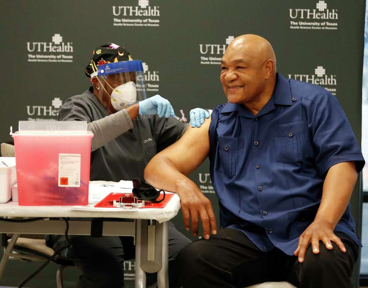 George Foreman gets his first dose of the coronavirus vaccine from Mary Young at UT Physicians Multispecialty - Victory clinic, in Houston, Thursday, Jan. 14, 2021. As vaccines for the coronavirus become available to Houston area residents over the age of 65 and those with underlying medical conditions, The University of Texas Health Science Center at Houston (UTHealth) and UT Physicians, the clinical practice of McGovern Medical School at UTHealth, partnered with the boxing legend to help overcome reluctance among minorities to be vaccinated.