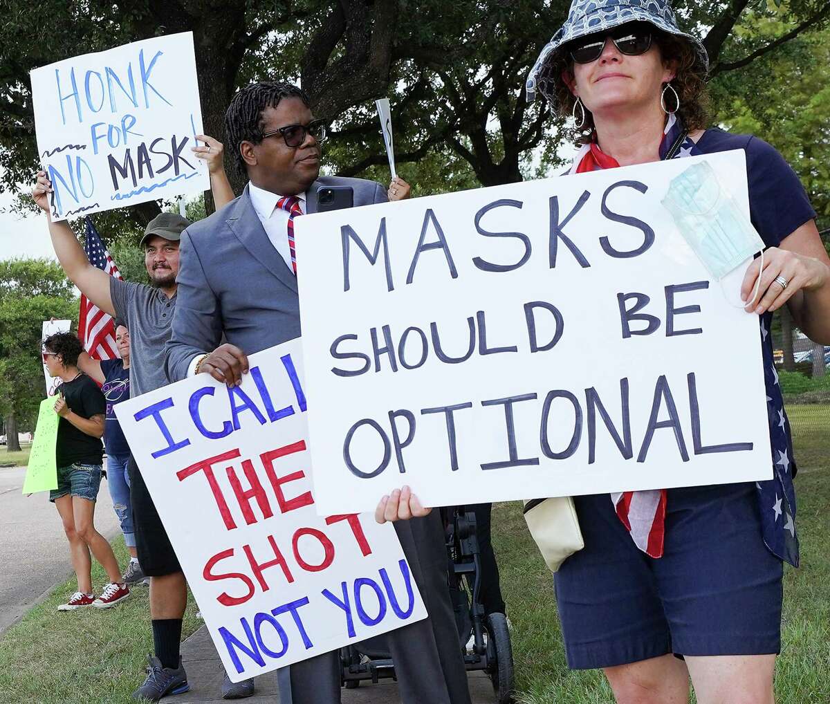 Anti-mask demonstrators outside Houston Intermediate School District building before it holds a meeting about having a mask mandate in Houston on Thursday, Aug. 12, 2021.