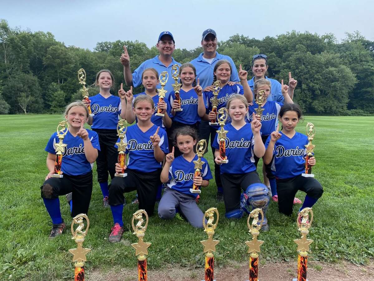 The Darien 8U Softball team recently won the annual Trumbull Invitational Softball Tournament 11-8 over Trumbull. Pictured from the left to the right in the front row are members of the team: Isla McNulty, Kaitlyn Cruikshank, Maddie McCarthy, Reagan Mullane and Evelyn Peloso. In the middle row are members of the team: Maeve Butler, Kendall Kaschel, Mia Laudicina, Ava Rongoe and Blaze Comfort. In the Back row are the coaches of the team: Sean McCarthy, Nick Rongoe and Michele Terra.