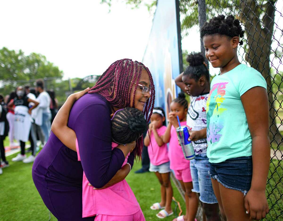 Laura Thompson of TAAN-TV embraces Laini Simmons during the launch of the “Work is the New Hustle” program at the Eastside Boys & Girls Club in June. New 2020 census numbers just released show that San Antonio’s population is becoming more racially and ethnically diverse.
