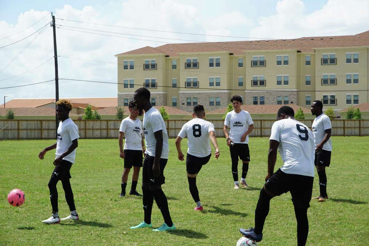 Members of the reVision Houston FC soccer team from southwest Houston warm up ahead of their last game together on Saturday, Aug. 7, 2021, at Roane Park in Missouri City, Texas. The team has 24 players who are all both immigrants and first-generation college students.