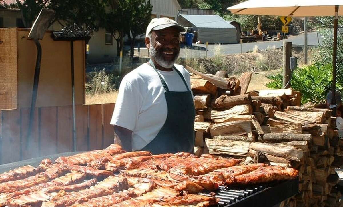 Charles "Buster" Davis grilling his famous ribs.