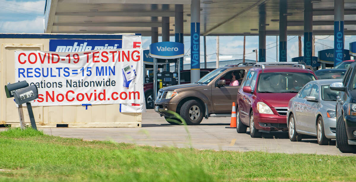 Laredoans line up at a Covid rapid testing site at the corner of San Dario Avenue and Shiloh Drive, Friday, Aug. 13, 2021.