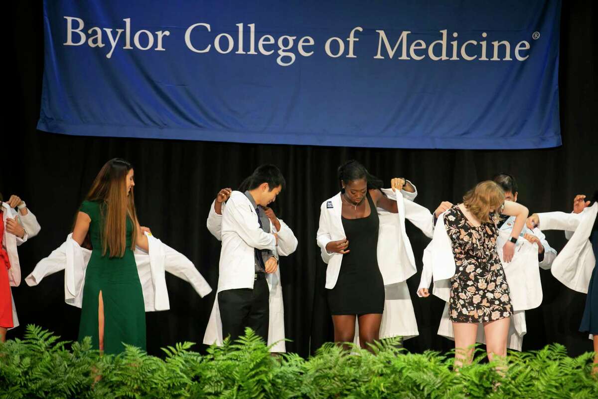 Baylor College of Medicine students receive their white coats in a ceremony at the Bayou City Event Center on Friday, Aug. 13, 2021.