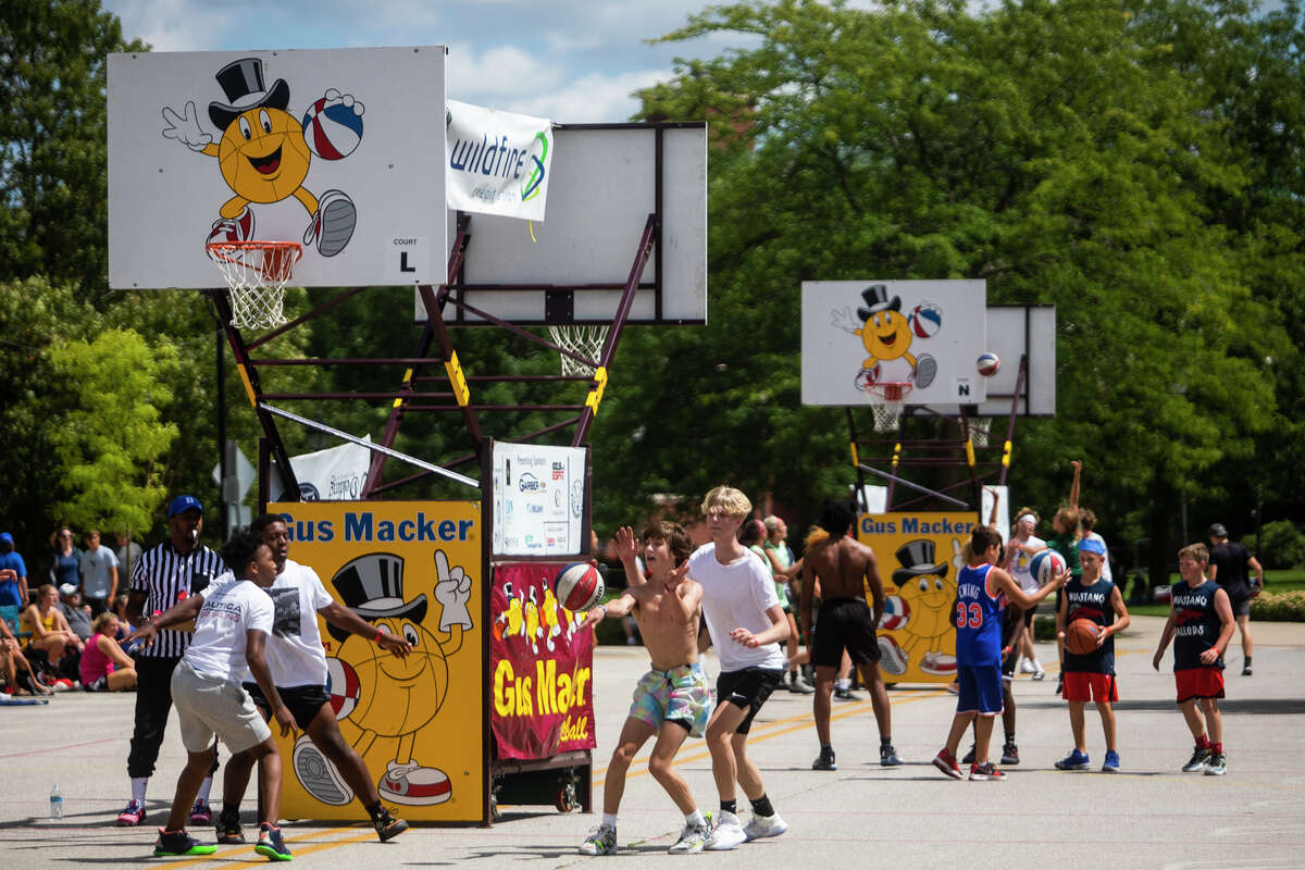 Hundreds of athletes compete in the Gus Macker 3 on 3 basketball tournament Saturday, Aug. 14, 2021 in downtown Midland. (Katy Kildee/kkildee@mdn.net)