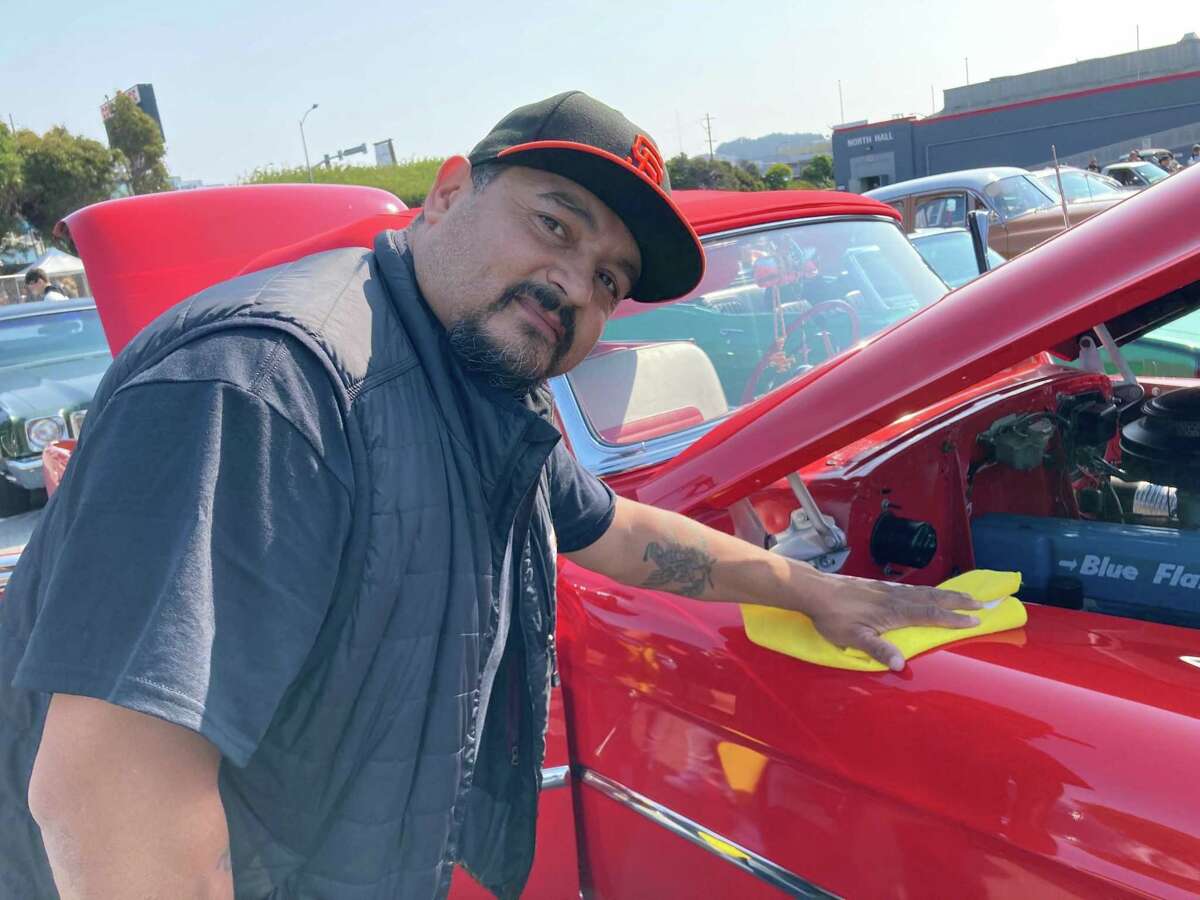 Low-rider show brings hopping muscle cars — and vaccines — to the