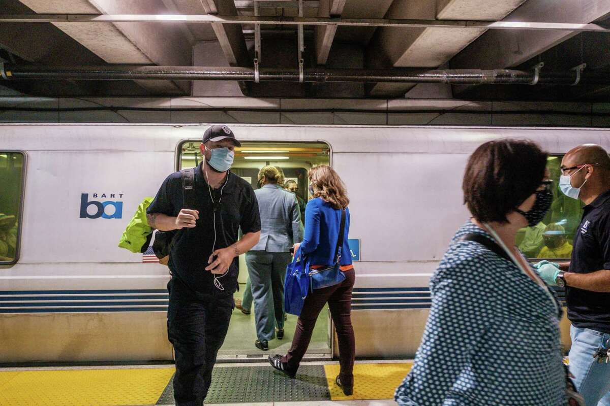 Riders are seen exiting and entering a BART train in San Francisco, Calif. BART reported yet another electrical problem in the Transbay Tube on Tuesday morning that led to major delays across the Bay Area — the third time in the last two weeks.